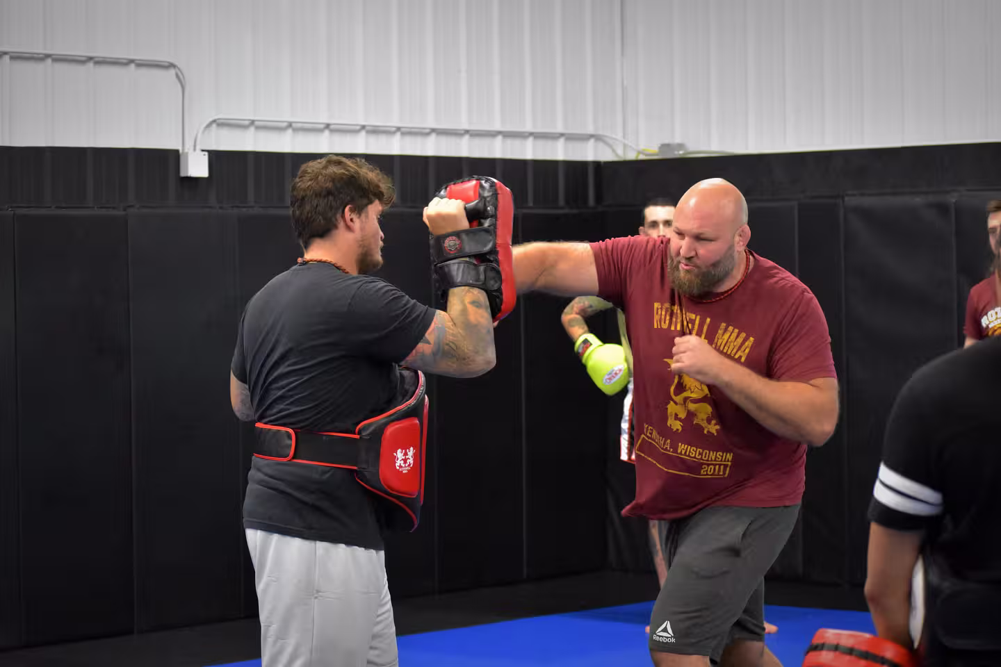 Ben Rothwell punching a martial arts target pad