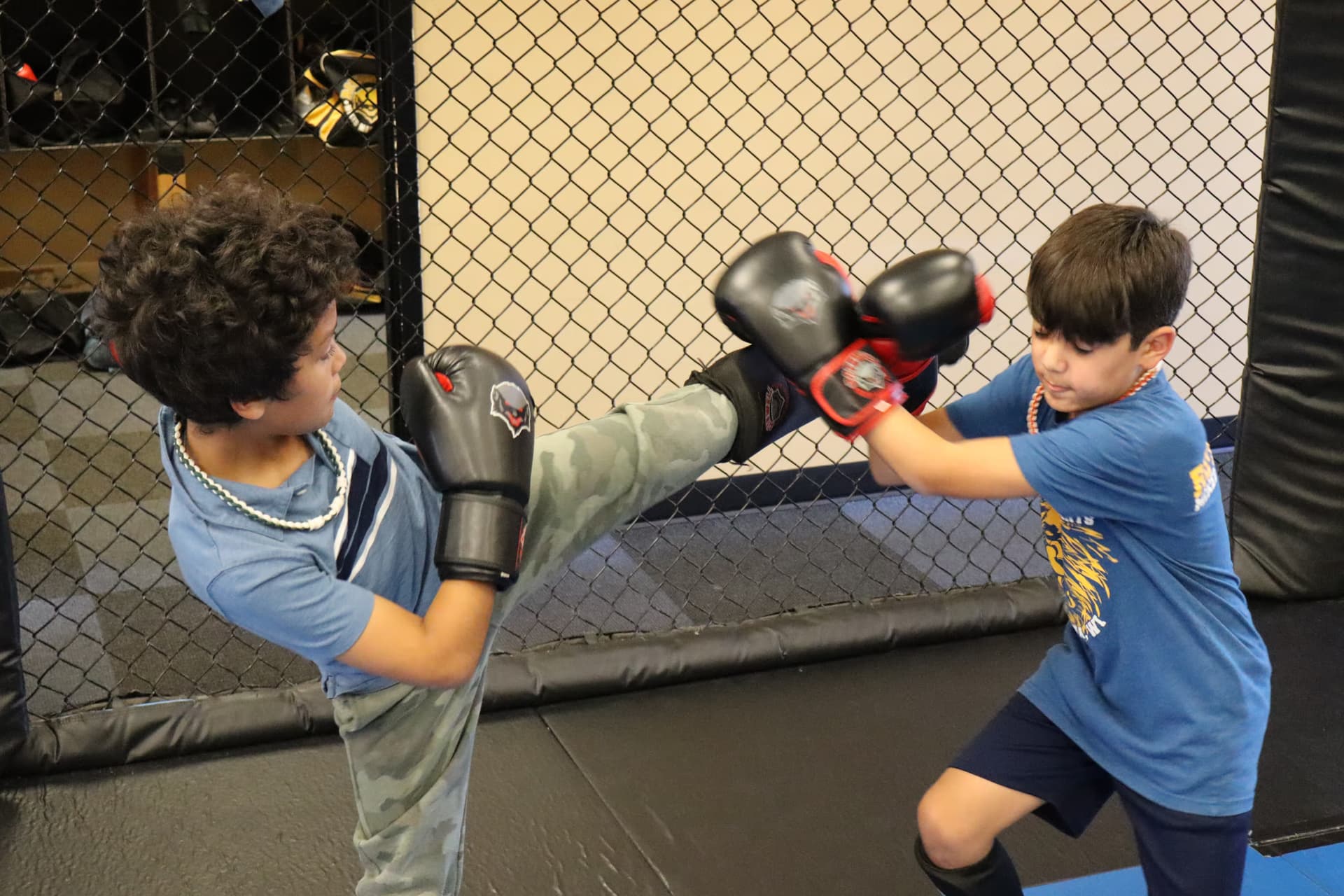 A youth kickboxing sparring session